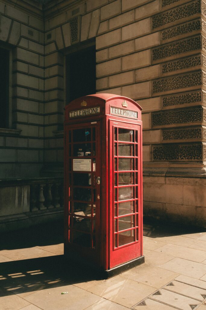 Iconic red telephone booth in London, featured in this London travel guide.