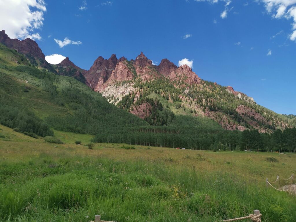 Stunning view of green valleys and red rock mountains in a popular winter travel destination in the USA.