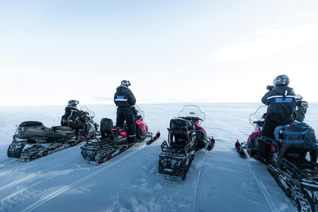 Snowmobiling adventure in Svalbard, featured in our Svalbard travel guide.